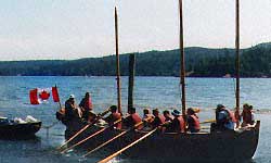 students row and sail the long boat